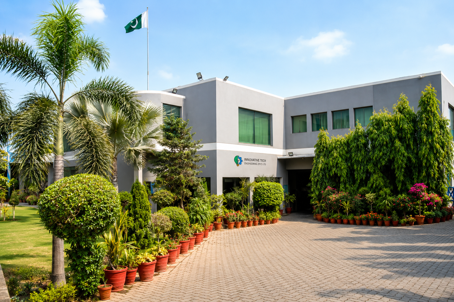 Exterior view of Innovative Tech Engineering Pvt Ltd manufacturing facility with landscaped entrance and corporate office.